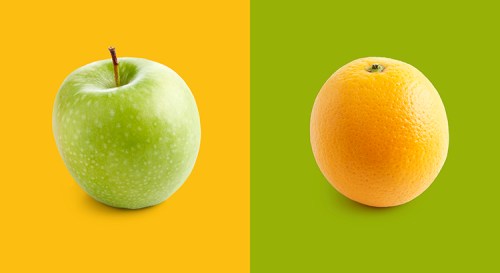 Apple and orange against yellow and green background